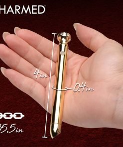 Gold charm measuring 4 inches in a hand