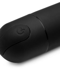 Close-up view of a sleek black device featuring a power button.