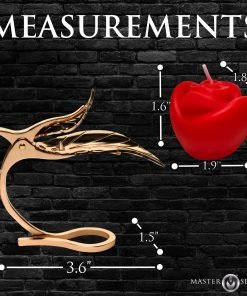 Gold decorative item next to a red rose candle with measurements displayed