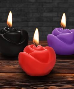 Colorful rose-shaped candles with flames