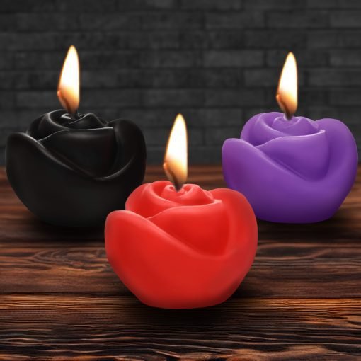 Colorful rose-shaped candles with flames