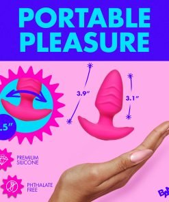 A bright pink silicone pleasure device displayed in a hand for scale.