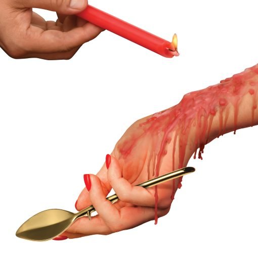 A hand holding a lit red candle dripping wax onto another hand holding a gold spoon