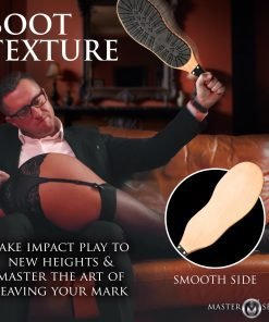 A man holding a paddle with a textured sole, preparing for impact play.