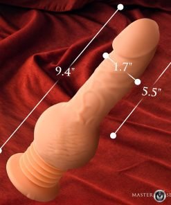 Realistic silicone phallus with measurements on a luxurious red fabric background.