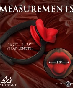 Red silicone mouth gag with adjustable strap on a silky background