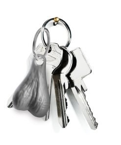 A set of keys with a novelty keychain shaped like a pair of testicles