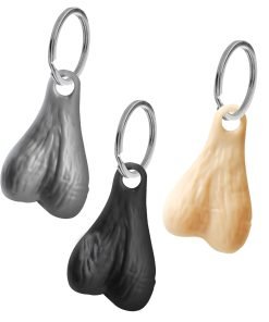Three novelty keychains shaped like anatomical features in black and beige colors.