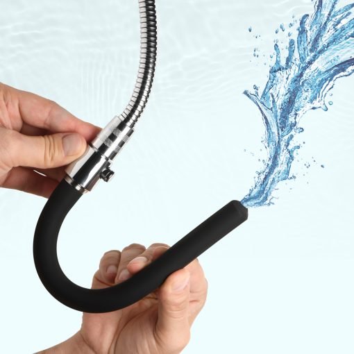Person holding a flexible hose spraying water
