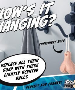 A humorous soap shaped like testicles hanging on a wall hook in a bathroom setting.