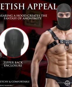 A model wearing a fetish hood and harness in a stylish interior