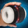 Hand holding a black and white circular device with light indicators