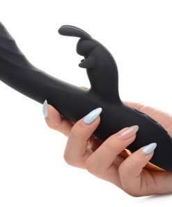 A person holding a sleek black adult toy with a unique design