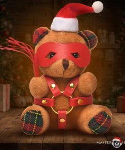 A playful teddy bear dressed for Christmas with a festive hat and a unique outfit, sitting amidst holiday decorations.