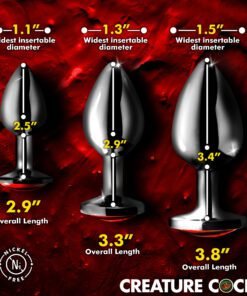 Three metallic anal plugs of varying sizes displayed on a red textured background.