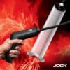 Hand holding a JOCK tool next to a transparent measuring cylinder against a fiery background