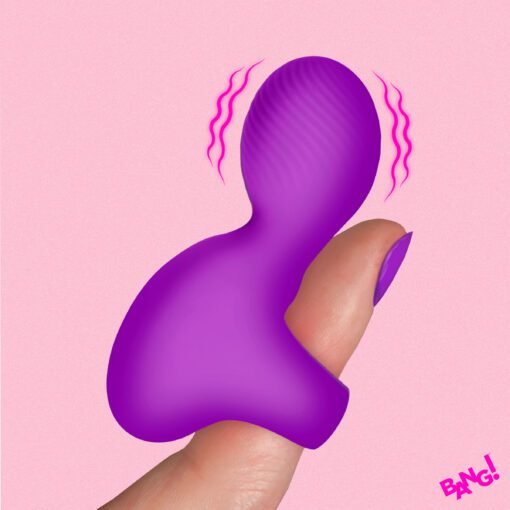 Vibrant purple silicone toy held between fingers against a pink background