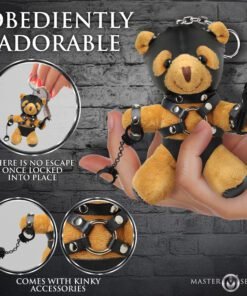 A plush bear in a playful bondage outfit, showcasing a unique design.