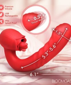 Red silicone toy with flower design on a bed