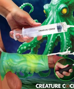 A hand holding a syringe labeled 'CREATURE COCKS' with an octopus in the background and a green, textured device in the foreground.