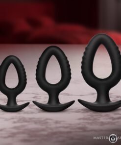 Three black silicone anal plugs of varying sizes