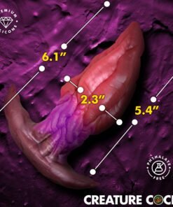 Colorful silicone adult toy with measurement markers on a textured background