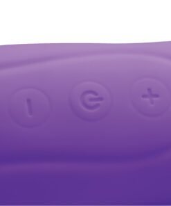 Close-up of a purple silicone device with control buttons