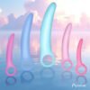 A collection of colorful silicone toys in pink and blue against a serene water background